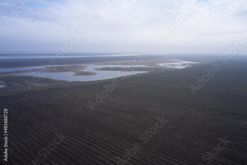 steppe plain landscape lake in the middle of fields