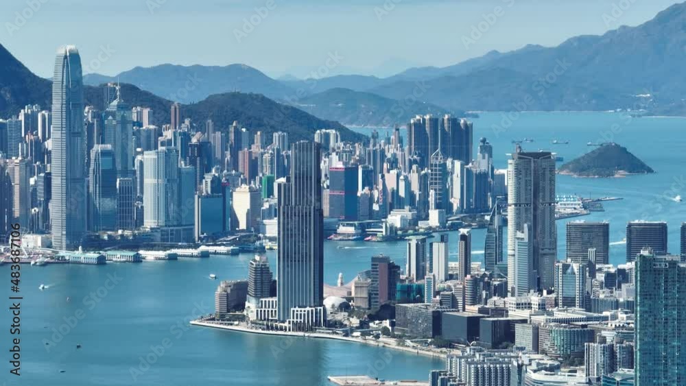 4K Tele zoom view of Hong Kong central district - slow pan aerial view angle from sky.