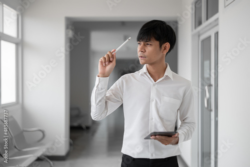 Pictures of cheerful man positively looking thinking about a idea.