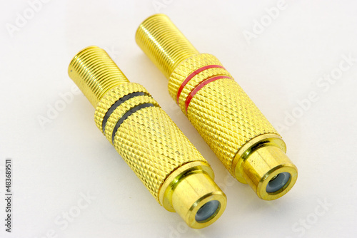 RCA connectors for connecting audio and video devices close-up on a white background.