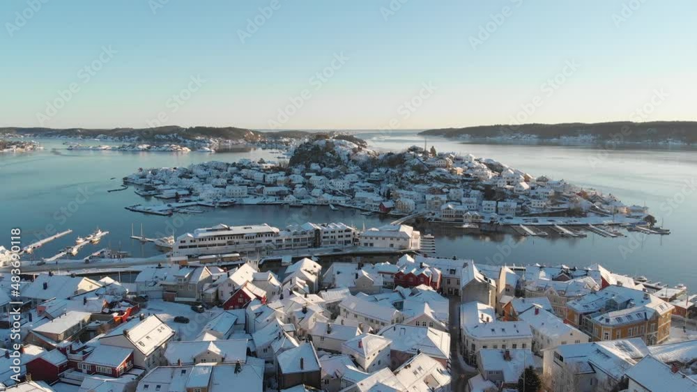Oya Island From Snowy Community of Kragerø On A Sunny Winter Day In Norway. - aerial Oya Island From Snowy Community of Kragerø On A Sunny Winter Day In Norway. - aerial