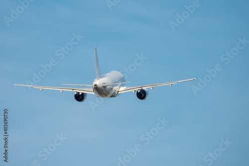 Commercial airplane flying. Travel and business concept.