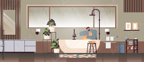 unhappy depressed man sitting in shower guy feeling desperate and lonely mental health diseases depression stress