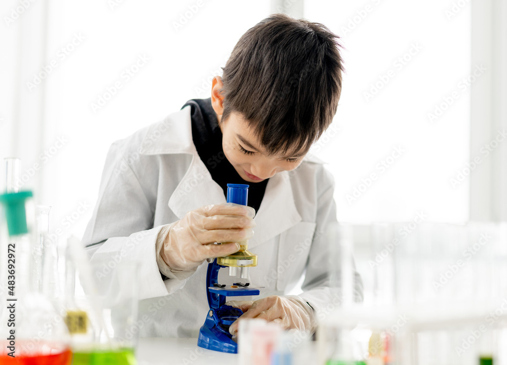 School boy in chemistry class School boy in chemistry class