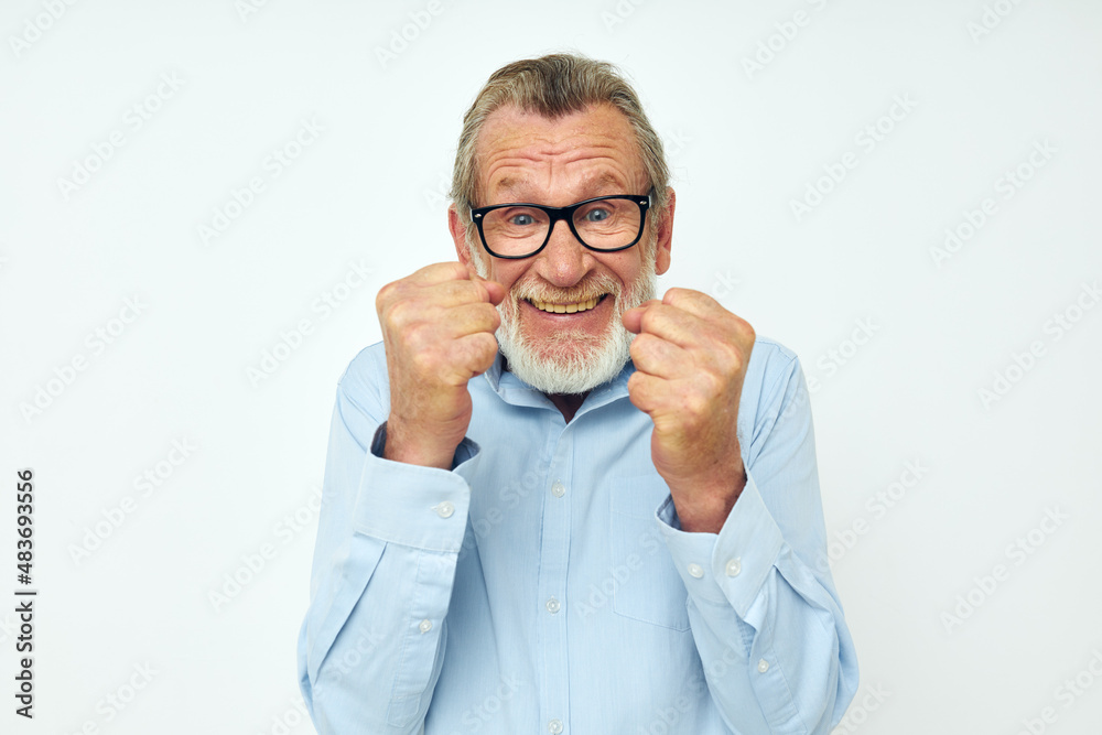 Portrait of happy senior man in shirt and glasses posing emotions cropped view Portrait of happy senior man in shirt and glasses posing emotions cropped view