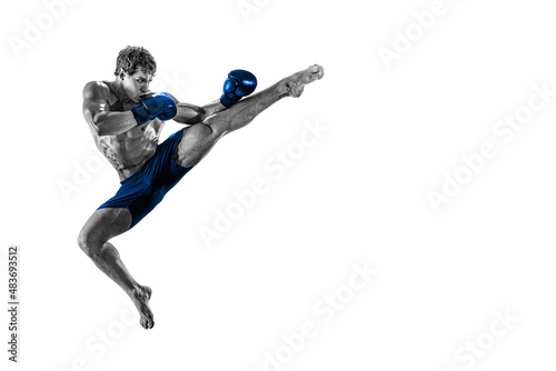 Black and white athlete boxer in jump in blue gloves isolated on white background. Sport concept