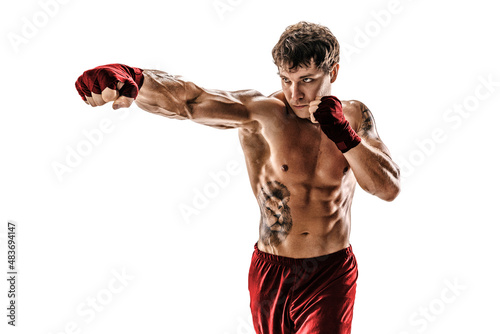 Portrait of male muscular boxer who training and practicing jab on white background. Red sportswear photo
