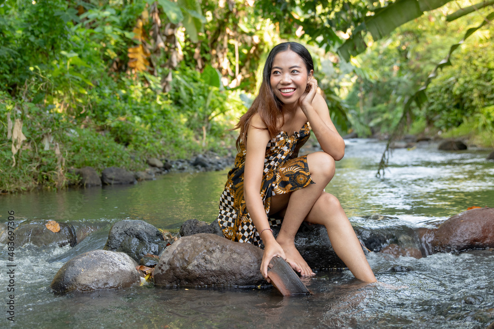 Fototapeta premium Young asian girl lady sexy and smiling relaxation sit bathing