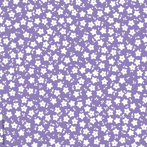 Seamless vintage pattern. Small white flowers and leaves . Lilac background. vector texture. fashionable print for textiles, wallpaper and packaging.