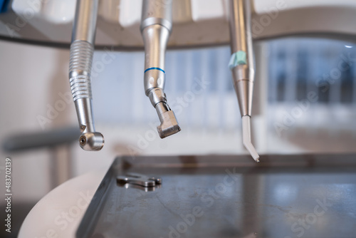 Close up of modern dentist tools, polishing machines with blurred background.