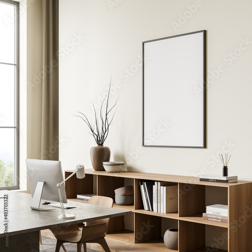 Bright office room interior with empty white poster, desktop © ImageFlow