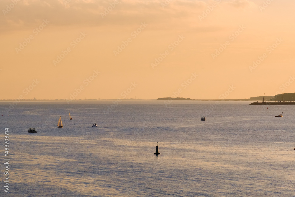Saint-Petersburg, Russia - Jun 09, 2021: The Gulf of Finland at sunset. Saint-Petersburg, Russia - Jun 09, 2021: The Gulf of Finland at sunset.