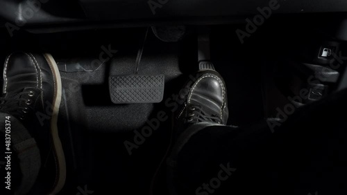 Accelerate and Brake. Foot pressing foot pedal of a car to drive ahead. Accelerator and brake pedal in a car. Driver driving the car by pushing accelerator pedals of the car. inside vehicle automobile