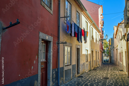 Alfama Lisboa district narrow street colored houses. Lisbon, Portugal