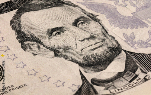 Five american dollars, with Abraham Lincoln close-up