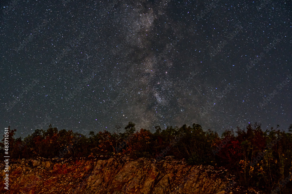 The mesmerizing view of Milky Way at the starry night sky Stock Photo ...