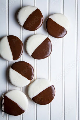 Black and White Cookies on a wooden white background photo