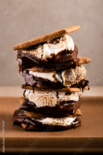 Four gooey s'mores stacked on top of each other. photo