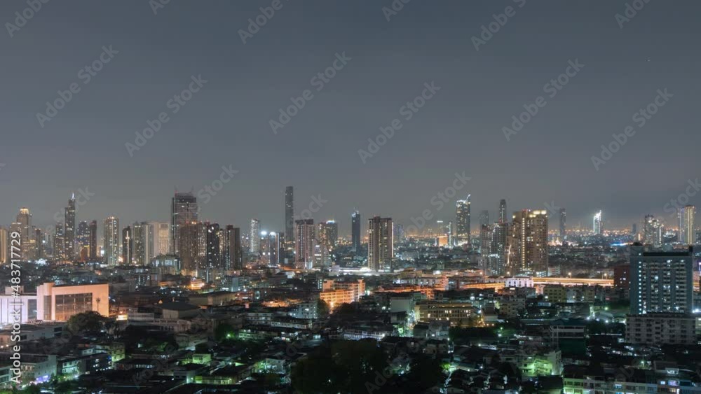 Time lapse of aerial view of Sathorn, Bangkok Downtown. Financial district and business centers in smart urban city in Asia. Skyscraper and high-rise buildings at night. Time lapse of aerial view of Sathorn, Bangkok Downtown. Financial district and business centers in smart urban city in Asia. Skyscraper and high-rise buildings at night.