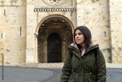 Young woman with lisbon cathedral in the background