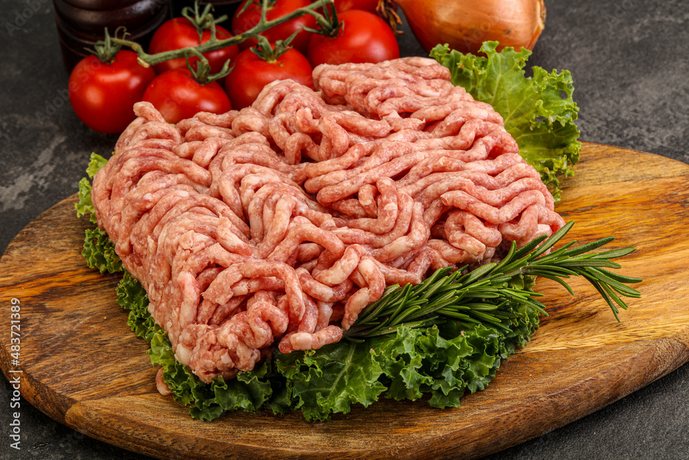 Raw pork minced meat over board Raw pork minced meat over board