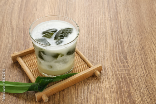 Es Cincau Hijau (green grass jelly), a traditional Indonesian dessert. Made from cincau, coconut milk and palm sugar. Selected focus.
 photo