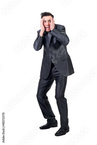 Fearful man in formal suit. White background. © Iván Moreno
