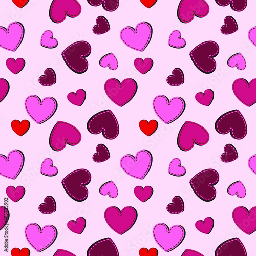 Seamless pink background with multicolored hearts