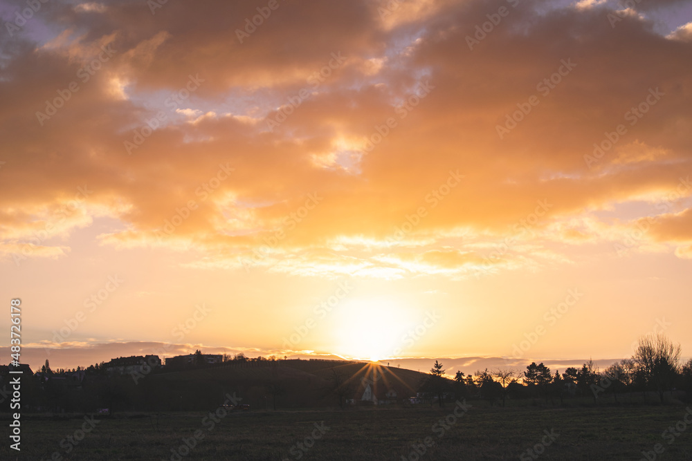 Naklejka premium sunset over the field