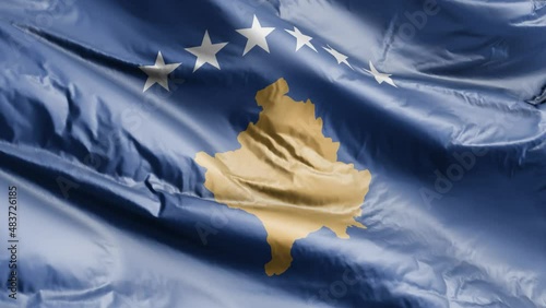 Kosovo flag waving on the wind loop. Kosovsky banner swaying on the breeze. Full filling background. 10 seconds loop. photo