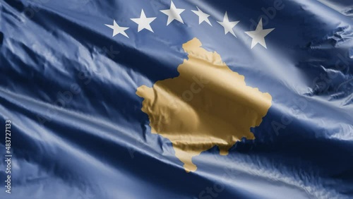 Kosovo flag slow waving on the wind loop. Kosovsky banner smoothly swaying on the breeze. Full filling background. 20 seconds loop. photo