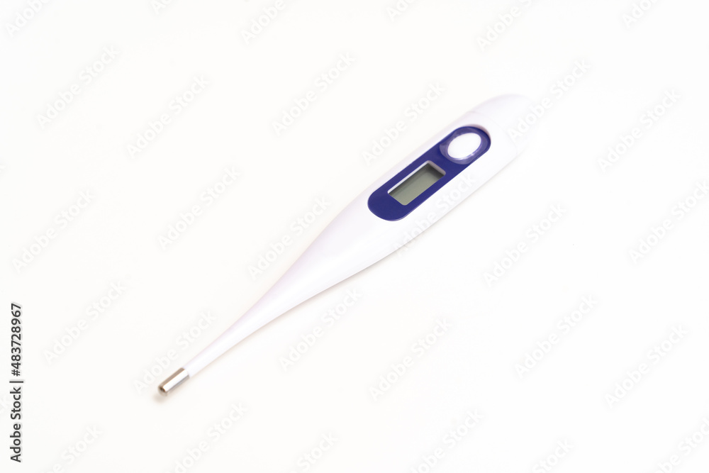 electronic thermometer on a white background. measuring device for measuring body temperature. home medicine cabinet. sale of medical products for home use. electronic thermometer on a white background. measuring device for measuring body temperature. home medicine cabinet. sale of medical products for home use.