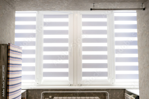 Quadro em tela Windows with open modern horizontal blinds indoors, closeup
