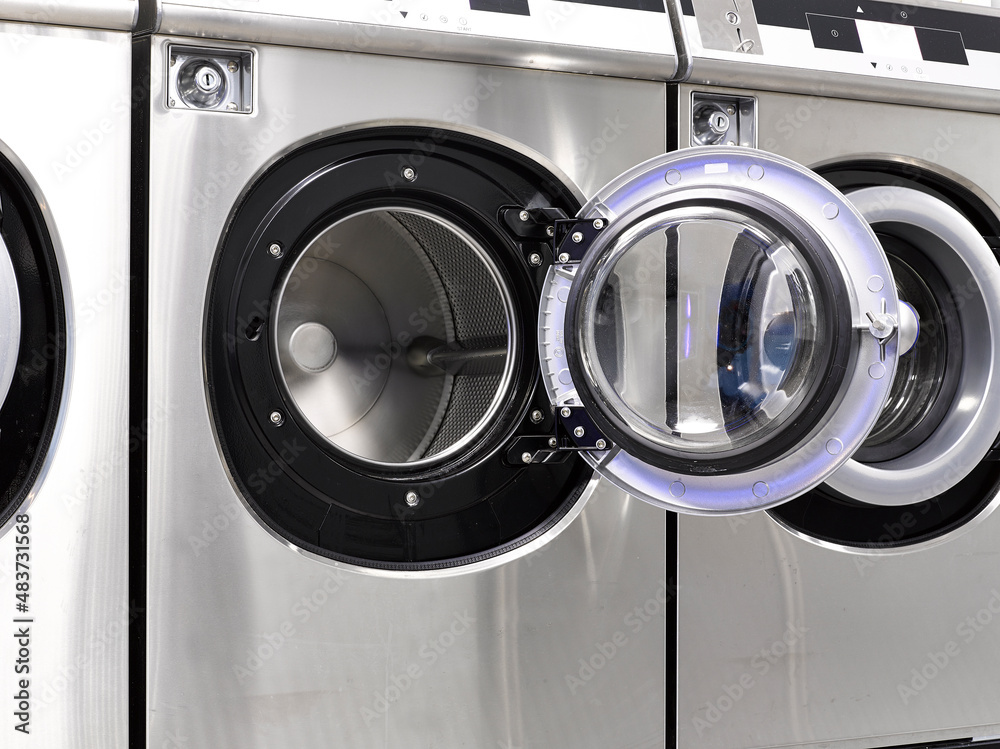Industrial washing machines in a public laundromat Industrial washing machines in a public laundromat