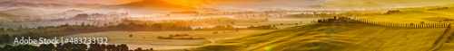 Tuscany, Italy landscape. Super high quality panorama taken at wonderful sunrise. Vineyards, hills, farm house.