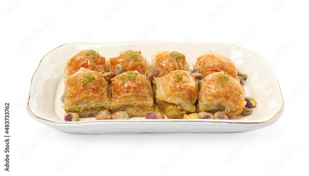 Plate of delicious baklava with pistachio nuts on white background Plate of delicious baklava with pistachio nuts on white background