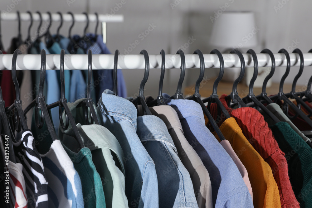 Fototapeta premium Rack with stylish clothes indoors, closeup. Fast fashion