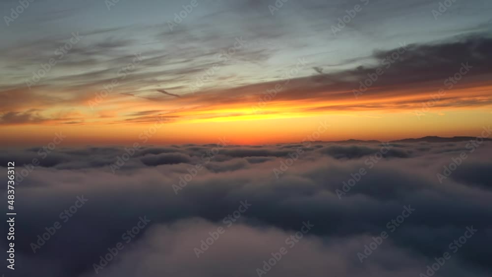 Flying Above The Clouds With Sunset Hue In The Horizon. - aerial Flying Above The Clouds With Sunset Hue In The Horizon. - aerial