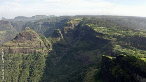 Scenic View Of Rocky Mountains Covered With Green Forest And Vegetation In Tamini Ghat, Maharashtra, India. - aerial photo