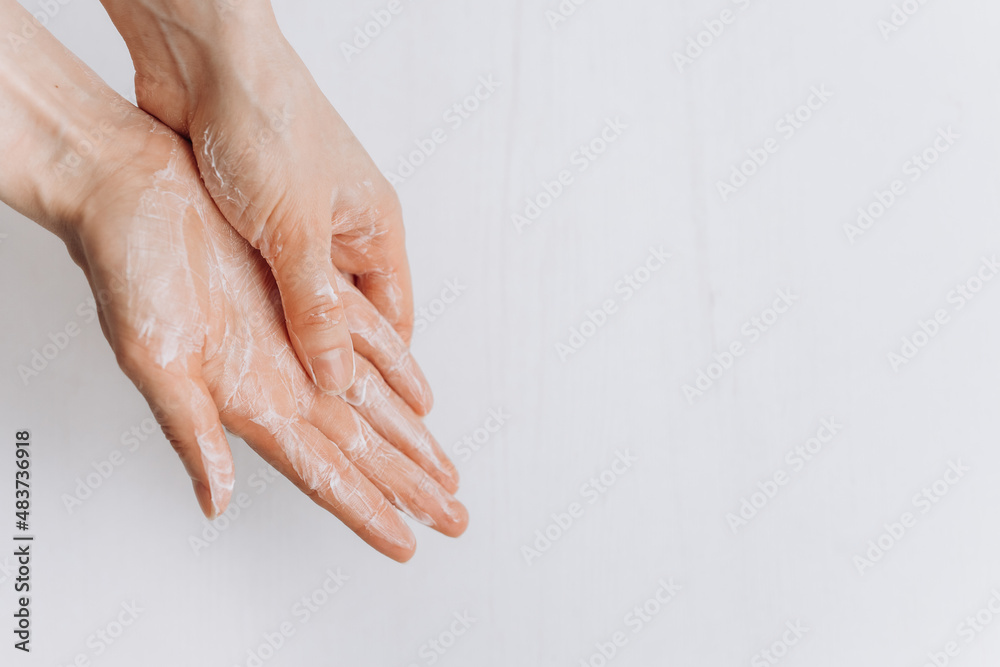 Soap hands in foam beauty health on a white background isolated.Hands cream Soap hands in foam beauty health on a white background isolated.Hands cream