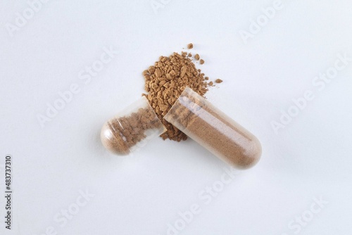 Closeup of the scatter powder from capsule. Isolated pill photo