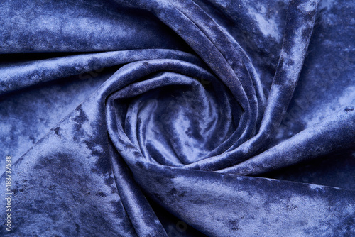 Dark blue fabric background, view from above