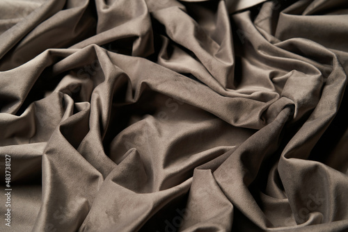 Beige fabric background, view from above