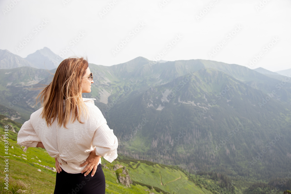 Young woman enjoy view in mountains. Young woman enjoy view in mountains.