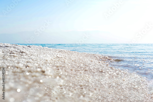 Close up of salt background. Natural salt. Dead Sea salt mineral natural formations. Salt crystals from Dead sea. View of Dead Sea coastline. Texture of Dead sea. Salty seashore rocks © Anastasia
