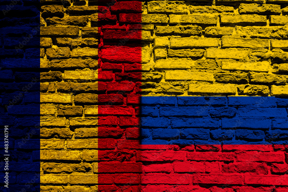 Background with flag of Chad and Colombia on a brick wall Background with flag of Chad and Colombia on a brick wall