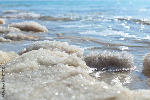 Close up of salt background. Natural salt. Dead Sea salt mineral natural formations. Salt crystals from Dead sea. View of Dead Sea coastline. Texture of Dead sea. Salty seashore rocks