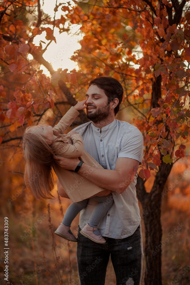 Fototapeta premium Family traditions. Father's day with his daughter at home. A handsome father with a little girl. Happy father and daughter. a little girl loves her daddy. happy Father's Day.Father's Day. 