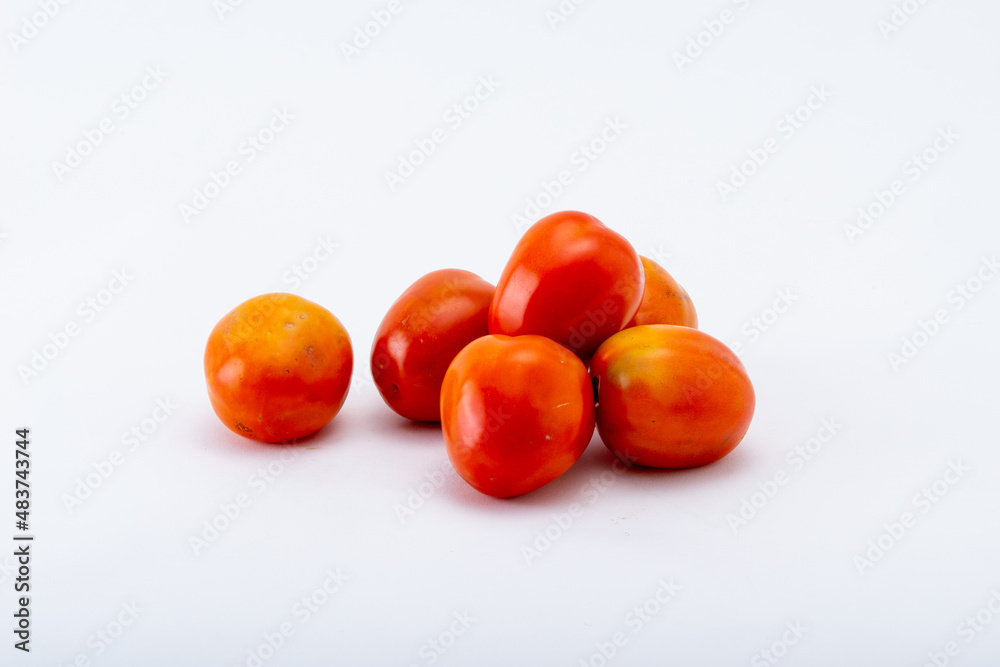 Top view. Tomatoes on the white background. Top view. Tomatoes on the white background.