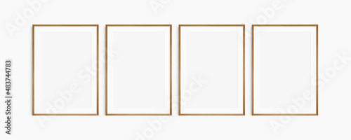 Frame mockup 5x7, 50x70, A4, A3, A2, A1. Set of four thin cherry wood frames. Gallery wall mockup, set of 4 frames. Clean, modern, minimalist, bright. Portrait. Vertical. Mat opening 2:3.